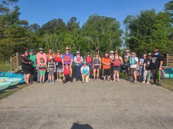 A group of volunteers paddled Lofton Creek to clean up litter during the annual St. Marys River cleanup event.