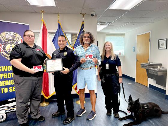 Derek Collins, FPBD Chief Jeff Tambasco, Paul Lore, Officer Tina Smith, and police dog Hanna. Derek Collins, the Regional Programs Director for The Fire Watch presents the Veterans Safe Space certification to the FBPD police chief at the station on Monday.  By Marisa DeMar 