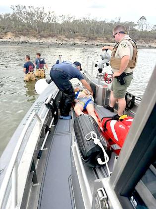 Nassau County first responders assisted in transporting an injured woman on the water Sunday at Boneyard Beach. Submitted