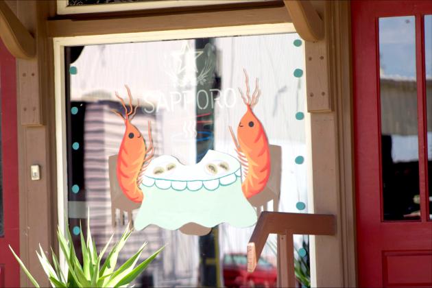 Art work painted by the FBHS National Art Honor Society on the downtown businesses as part of their annual fundraiser with the Fernandina Beach Main Street organization. By Marisa DeMar News-Leader
