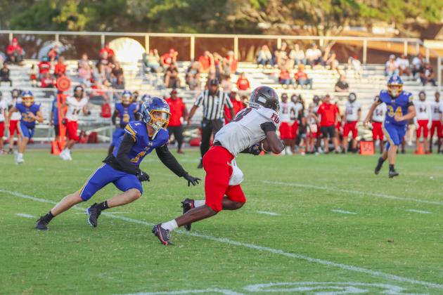 Fernandina Beach High School Junior Beckham Rohe makes a tackle in a game against Fort White in the 2025-26 season. Rohe earned First Team Defense, All SSAA Atlantic; and Second Team Defense, All Northeast Florida. Photo by Ashley Chandler/News-Leader