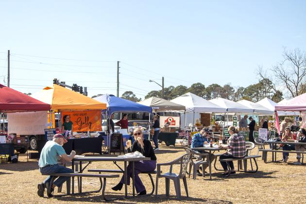 Visitors at the Midweek Farmers Market in Fernandina Beach earlier this year. The market is on a hiatus while parking requirements are sorted out. Photo by Ashley Chandler/News-Leader