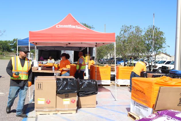 Volunteers and Clean Harbors, the company contracted for both events, help locals to unload items to discard at Saturday’s Household Hazardous Waste Collection in Fernandina Beach. Photo by Ashley Chandler/News-Leader