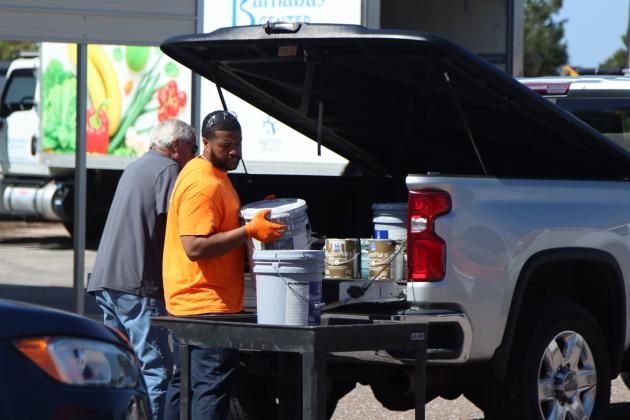 Volunteers and Clean Harbors, the company contracted for both events, help locals to unload items to discard at Saturday’s Household Hazardous Waste Collection in Fernandina Beach. Photo by Ashley Chandler/News-Leader
