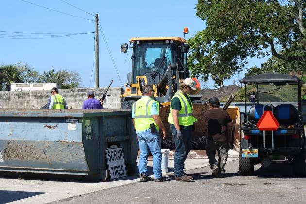 Volunteers and Clean Harbors, the company contracted for both events, help locals to unload items to discard at Saturday’s Household Hazardous Waste Collection in Fernandina Beach. Photo by Ashley Chandler/News-Leader