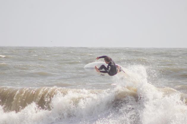 Surfers Aiden Flynn, CJ Rogers and Noah Poteat were out on the water Sunday at Main Beach. Photo by Marisa DeMar/News-Leader