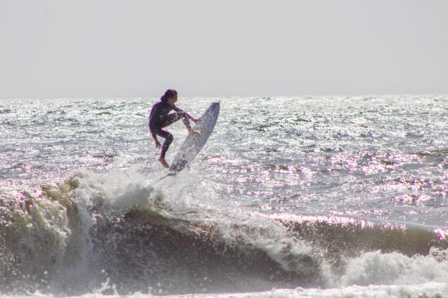 Surfers Aiden Flynn, CJ Rogers and Noah Poteat were out on the water Sunday at Main Beach. Photo by Marisa DeMar/News-Leader