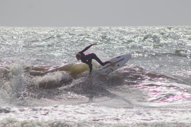 Surfers Aiden Flynn, CJ Rogers and Noah Poteat were out on the water Sunday at Main Beach. Photo by Marisa DeMar/News-Leader