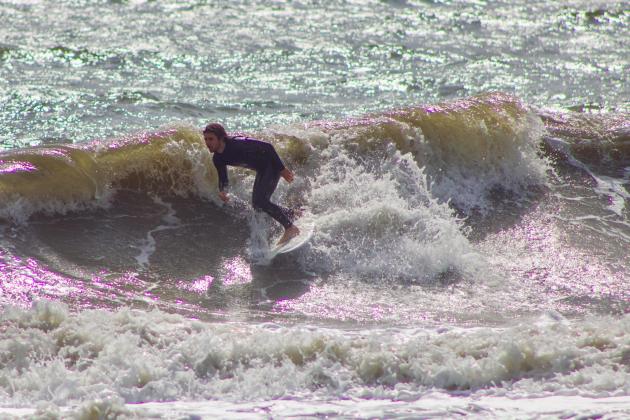 Surfers Aiden Flynn, CJ Rogers and Noah Poteat were out on the water Sunday at Main Beach. Photo by Marisa DeMar/News-Leader