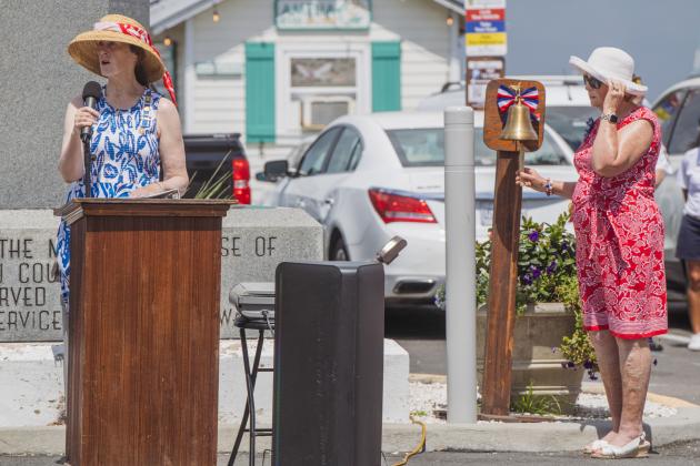 Members of the Daughters of the American Revolution honor the sacrifice of service members on Monday.