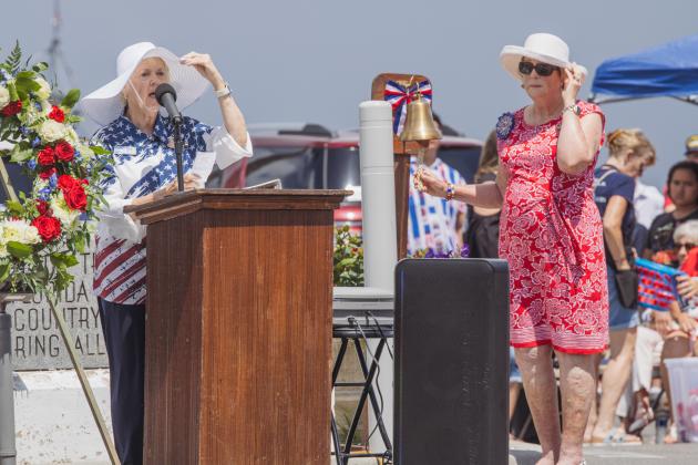 Members of the Daughters of the American Revolution honor the sacrifice of service members on Monday.