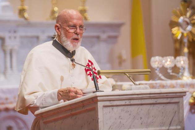 Father Ernie Davis delivers a history lesson at St. Michael’s Catholic Church prior to the pilgrimage. By Nick Blank/News-Leader