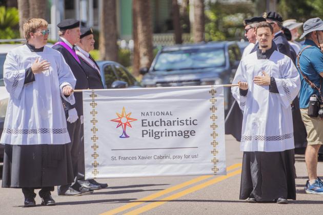 Clergy from St. Michael’s Catholic Church walk to the Fernandina Harbor Monday for the National Eucharistic Pilgrimage. Nick Blank/News-Leader