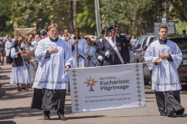 Clergy from St. Michael’s Catholic Church walk to the Fernandina Harbor Monday for the National Eucharistic Pilgrimage. Nick Blank/News-Leader