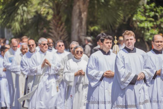 Clergy from St. Michael’s Catholic Church walk to the Fernandina Harbor Monday for the National Eucharistic Pilgrimage. Nick Blank/News-Leader