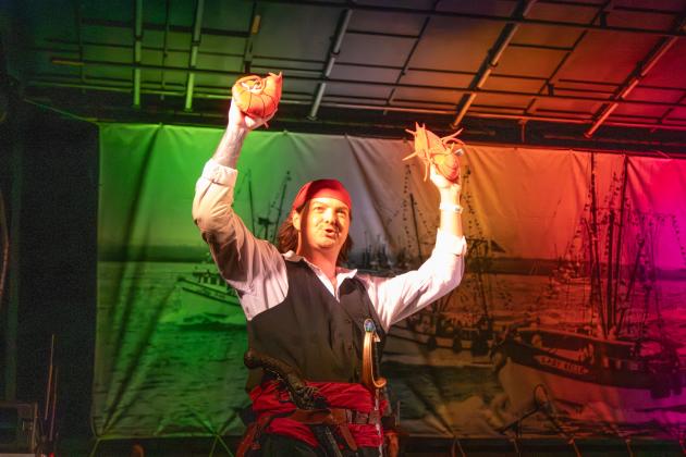 One of the Pirate Club’s newest members, Jackson Lee, holds up stuffed shrimp during the club’s program, Invasion of the Pirates on Friday at Shrimp Fest. Photo by Ashley Chandler/News-Leader