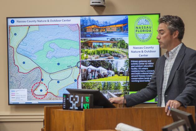 Taylor Clem discusses potential future uses for the 223 acres the county purchased at the April 27 Board of County Commissioners meeting. Staff says the property will be used mostly for conservation purposes. Photo by Ashley Chandler/News-Leader
