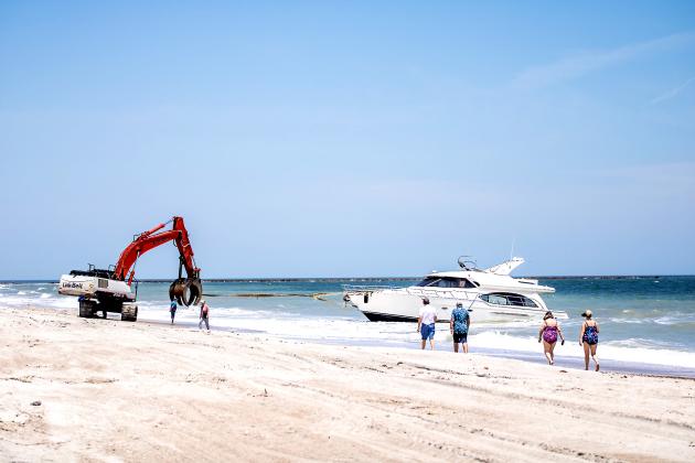 Maverick Marine Services brings the vessel, Coco, onto the beach on Fernandina Beach near Beach Access 16N.  Nick Blank/News-Leader