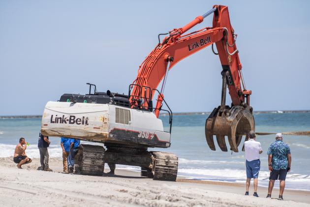 Maverick Marine Services brings the vessel, Coco, onto the beach on Fernandina Beach near Beach Access 16N.  Nick Blank/News-Leader