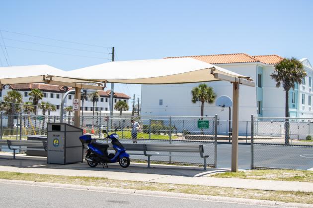 An electrict scooter is parked at the basketball courts near Main Beach Park. Ashley Chandler/News-Leader