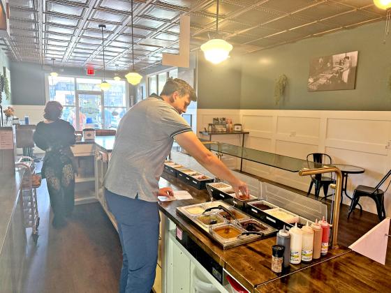 Customers can choose what toppings they would like on their donuts at Vintage Donuts. Submitted photo
