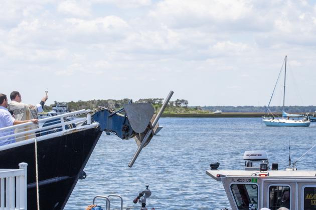 Father Eric Stelzer of St. Michaels Catholic Church blesses the fleet Sunday at the 61st Annual Eight Flags Shrimp Festival. Photo by Nick Blank/News-Leader