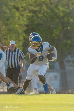 Fred Jones carries the ball in Wednesday’s spring matchup between FBHS and Menendez. PHOTOS COURTESY OF MEGAN LOUISE PHOTOS