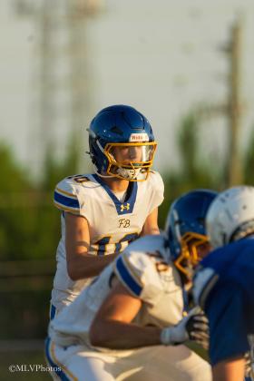 Fernandina Beach High School’s quarterback Talan Van Delinder waits for the snap in Wednesday’s off-season matchup against Menendez. PHOTOS COURTESY OF MEGAN LOUISE PHOTOS
