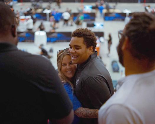 Turtle Ricks celebrates with his mother, Melissa, after winning a state title at the FHSAA Weightlifting State Championships last week. Photos by Hitsquad Media