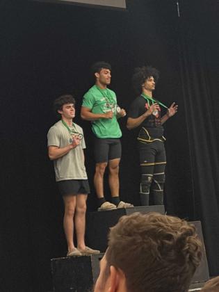 Clay Hicks, left, came in third in Traditional for the 154-pound weight class. Submitted photo