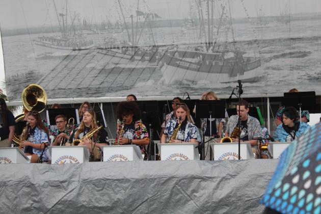 The Fernandina Beach High School Jazz Ensemble performed in the rain Saturday morning at the 61st annual Eight Flags Shrimp Festival. Photo by Amy Mulligan/News-Leader