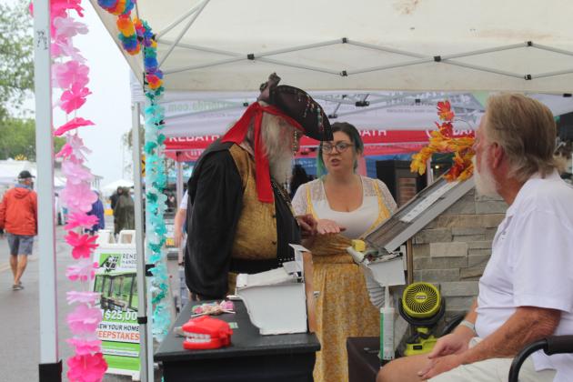 Shrimp Fest gets rained on Saturday. Photo by Amy Mulligan/News-Leader