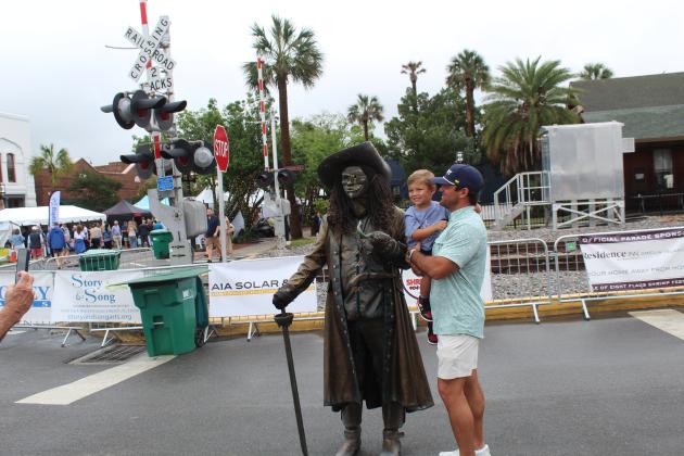 Shrimp Fest continues after the rain on Saturday. Photo by Amy Mulligan/News-Leader