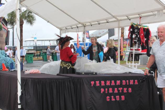 Shrimp Fest continues after the rain on Saturday. Photo by Amy Mulligan/News-Leader