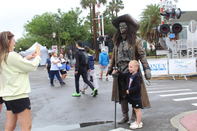 Shrimp Fest continues after the rain on Saturday. Photo by Amy Mulligan/News-Leader