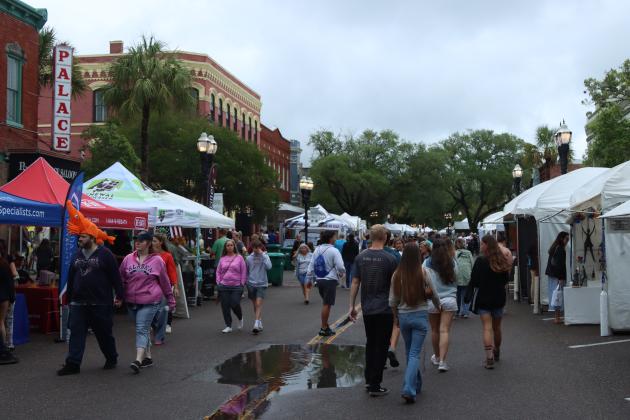 Shrimp Fest continues after the rain on Saturday. Photo by Ashley Chandler/News-Leader