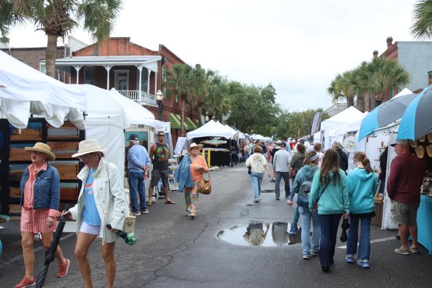 Shrimp Fest continues after the rain on Saturday. Photo by Ashley Chandler/News-Leader