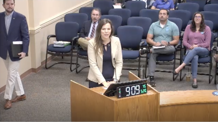 Nassau County Stormwater Director Katie Peay, middle, introduced Sean Lahav, associate vice president and resilience market leader for Halff, left, at the May 20 Board of County Commissioners meeting at the James S. Page Governmental Complex. Image from screenshot