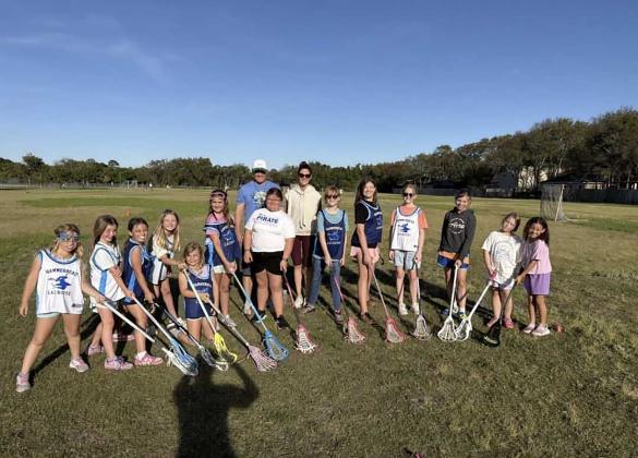 The elementary-aged girls pose for a photo at the end of the 2026 Spring season. Submitted photo