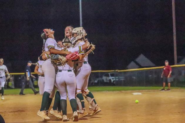 Lady Hornet softball players celebrate after making the final out in Wednesday’s regional tournament win over the West Nassau Warriors. Photo by Amanda Bishop/Nassau County Record