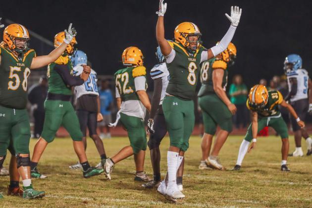 Cody Ogburn, No. 58, and Jaison Brown, No. 8 celebrate in a game during the 2025 season. Both Ogburn and Brown will be seniors this Fall. Photo by Ashley Chandler/News-Leader