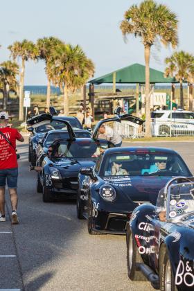 The Gumball 3000 rolls through Main Beach Park. Photo by Ashley Chandler/News-Leader