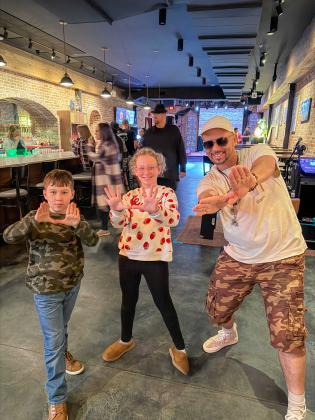 Supreme of the Wu-Tang Clan, right, with Brian Bowen's kid during Southern Edge Collective's trial run of a film showing at the Tigre Island Room in December 2025. Submitted photo