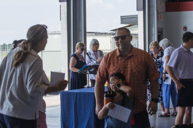 Lisa Senter of DAR, middle, led the organization efforts of the group's flag retirement event. Ashley Chandler/News-Leader