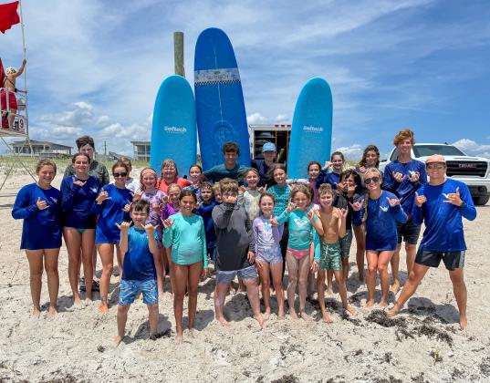 Local youth take part in the Amelia Island Surf Co. summer surf camp.  Photo by Brian Bowen