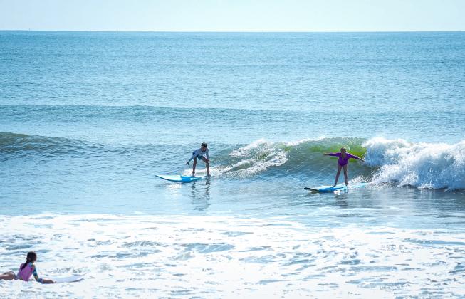 Local youth take part in the Amelia Island Surf Co. summer surf camp.  Photo by Brian Bowen
