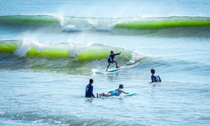 Local youth take part in the Amelia Island Surf Co. summer surf camp.  Photo by Brian Bowen