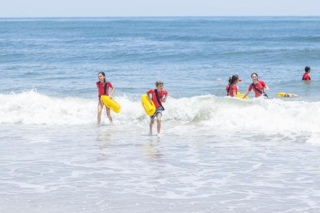 Participants of the Junior Lifeguard Camp take park in an exercise Wednesday at Seaside Park. The first weeklong session of the camp was held this week. Photo by Ashley Chandler/News-Leader