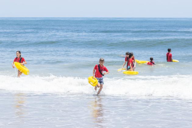 Participants of the Junior Lifeguard Camp take park in an exercise Wednesday at Seaside Park. The first weeklong session of the camp was held this week. Photo by Ashley Chandler/News-Leader