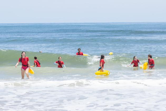 Participants of the Junior Lifeguard Camp take park in an exercise Wednesday at Seaside Park. The first weeklong session of the camp was held this week. Photo by Ashley Chandler/News-Leader